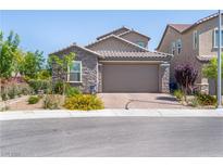 Charming single-story home featuring stone accents and a well-maintained front yard at 4376 Latitude Valley Ct, North Las Vegas, NV 89084