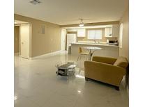 Bright living room with tile floors, modern furnishings, and an open layout at 4420 Rich Dr # B, Las Vegas, NV 89102