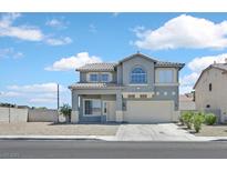 Two-story home featuring desert landscaping and a well-maintained front yard at 5923 Halehaven Dr, Las Vegas, NV 89110