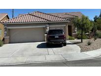 Charming single-story home featuring a spacious driveway, a two-car garage, and desert landscaping at 7559 Chambery Cove Ct, Las Vegas, NV 89123