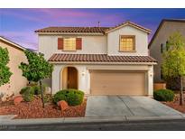 Charming two-story home features a tile roof and a well-maintained front yard at 10557 Bandera Mountain Ln, Las Vegas, NV 89166