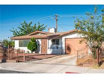 Charming single-story home with a well-maintained yard, gated entrance, and attached one-car garage at 1716 Luning Dr, Las Vegas, NV 89106
