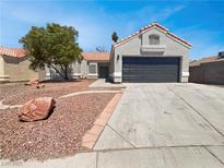 Charming single-story home featuring a two-car garage and low-maintenance desert landscaping at 3804 Wren Ct, North Las Vegas, NV 89032