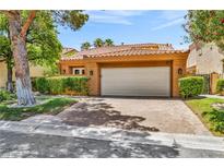 Charming single-story home with a well-manicured lawn and a spacious two-car garage at 5123 Southern Hills Ln, Las Vegas, NV 89113