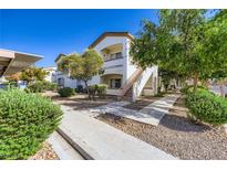 Inviting condo exterior with landscaped grounds and a private balcony at 5650 E Sahara Ave # 1001, Las Vegas, NV 89142