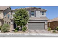 Charming two-story home featuring a two-car garage, desert landscaping, and a well-maintained front yard at 7890 S Miller Ln, Las Vegas, NV 89113