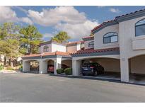 Charming townhome featuring assigned covered parking, tile roof and mature landscaping at 8455 W Sahara Ave # 289, Las Vegas, NV 89117