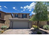 Charming two-story home with a well-maintained front yard, brick driveway, and a two-car garage at 9205 Valley Betica Ave, Las Vegas, NV 89148