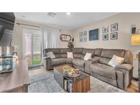 Inviting living room featuring a comfortable sectional sofa and stylish decor, creating a cozy atmosphere at 12280 Golden Wreath Rd # 3, Las Vegas, NV 89183