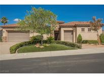Charming single-story home with a well-manicured lawn, mature landscaping, and a three-car garage at 2080 Powder Springs St, Henderson, NV 89052