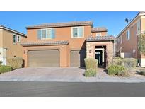 Charming two-story home featuring a three car garage and landscaped front yard at 2194 Trivero St, Henderson, NV 89044