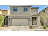Charming two-story home features a neutral color scheme, attached garage, and well-manicured landscaping at 2531 Dollison Ave, North Las Vegas, NV 89081