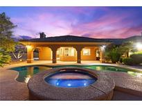 Stunning backyard features a sparkling pool and spa, perfect for outdoor relaxation and entertaining at 5680 N Fort Apache Rd, Las Vegas, NV 89149