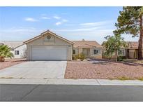 Charming single-story home with a two-car garage, complemented by low maintenance landscaping and a tiled roof at 6209 Lenaking Ave, Las Vegas, NV 89122