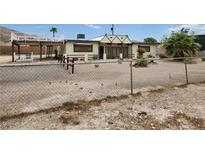 Charming front yard view of home, showing fence, landscaping and elevated deck at 66 Lailani St, Las Vegas, NV 89110