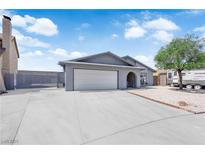 Single story house featuring a two-car garage and a spacious driveway in front of the property at 6741 Bonillo Dr, Las Vegas, NV 89103