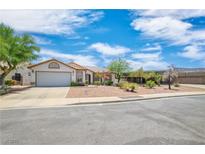 Charming single-story home featuring a well-manicured xeriscaped front yard and attached two-car garage at 114 Tamarack Dr, Henderson, NV 89002