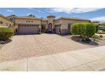 Charming single-story home featuring a decorative front door and a spacious three-car garage at 1329 Calle Cantar, Henderson, NV 89012