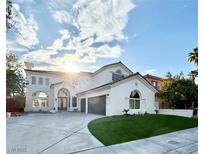 Stunning two-story home with a well-manicured lawn and a spacious driveway, perfect for modern living at 2469 Sun Reef Rd, Las Vegas, NV 89128