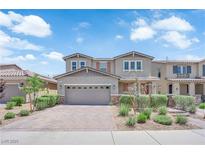 Charming two-story home with a two-car garage and beautifully landscaped front yard in a residential neighborhood at 2714 Frabiele St, Henderson, NV 89044