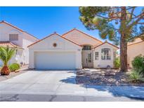 Charming single-story home with a well-maintained front yard and a two-car garage at 2752 Devita Cir, Las Vegas, NV 89117