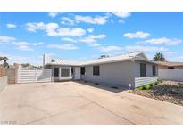 Charming single story home featuring a gray exterior, white trim, and spacious concrete driveway at 5155 Saratoga Dr, Las Vegas, NV 89120