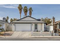 Charming single-story home with a two-car garage and low maintenance front yard at 59 N Christy Ln, Las Vegas, NV 89110