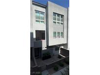 Modern townhouse featuring a private courtyard, balcony, and large windows at 659 Spotted Falcon St, Las Vegas, NV 89138