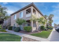 Two-story condo building with well-kept landscaping and multiple balconies at 2305 W Horizon Ridge Pkwy # 3921, Henderson, NV 89052