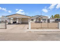 Charming single-story home featuring a carport, gated front yard, and desert landscaping at 2854 La Canada St, Las Vegas, NV 89169