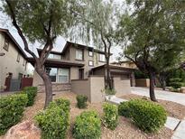 Charming two-story home with a well-maintained lawn and mature trees at 5466 Fawn Chase Way, Las Vegas, NV 89135