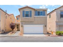 Two-story home with neutral stucco, matching shutters, a front yard, and a two car garage at 7553 Virginia Dale St, Las Vegas, NV 89131