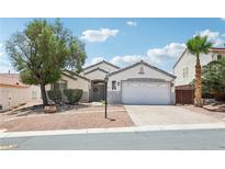 Charming single story home with a desert landscape and a two car garage and beautiful blue skies at 7927 Villa Salsa Ave, Las Vegas, NV 89131