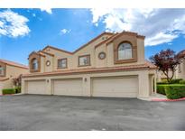 Charming townhome featuring three garages and desert landscaping at 8301 Boseck Dr # 232, Las Vegas, NV 89145