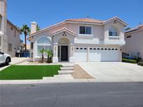 Charming two-story home with three-car garage, landscaped front yard, and updated facade at 9556 Ancala Hollow Ct, Las Vegas, NV 89148