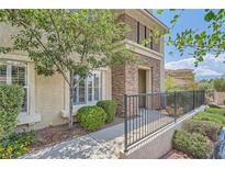 Charming home exterior featuring desert landscaping, decorative stone accents, and an inviting entrance at 10809 Garden Mist Dr # 1042, Las Vegas, NV 89135