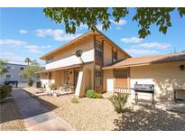 Charming two-story condo featuring a private patio and a well-maintained exterior at 1407 Dorothy Ave # 2, Las Vegas, NV 89119