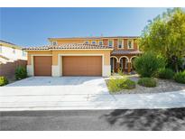 Inviting home with a two car garage, meticulous landscaping, and neutral colors at 1633 Dornie Ave, North Las Vegas, NV 89084