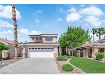 Charming two-story home with a well-manicured lawn and a two-car garage at 21 Rue De Degas, Henderson, NV 89074