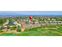 Expansive aerial view of luxury homes overlooking lush golf course with city skyline in the distance at 2997 Via Meridiana, Henderson, NV 89052