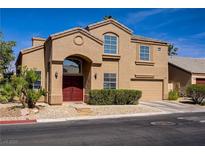 Inviting two-story home with a well-maintained lawn and a symmetrical facade at 3420 Lockport St, Las Vegas, NV 89129