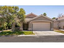 Charming single-story home featuring a two-car garage and well-maintained front yard at 4825 White Aspen Ave, Las Vegas, NV 89130