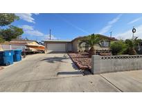 Charming home with an attached garage, boat, and low-maintenance desert landscaping at 5209 Del Monte Ave, Las Vegas, NV 89146