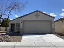 Charming single-story home with a well-maintained front yard and a two-car garage at 5912 Kentlands St, Las Vegas, NV 89130