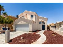 Charming two-story home featuring a two-car garage and well-maintained front yard landscaping at 6112 Grape Blossom Ave, Las Vegas, NV 89142