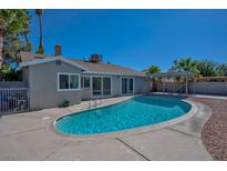 Inviting in-ground pool with concrete surround, perfect for relaxation and outdoor enjoyment at 6848 Groveview Ln, Las Vegas, NV 89103
