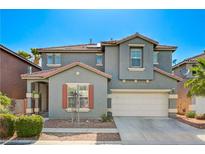 Charming two-story home featuring a gray facade, red tile roof, and well-maintained landscaping at 9021 Rendon St, Las Vegas, NV 89143