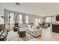 Bright and airy living room with neutral tones, plush seating, and abundant natural light at 113 Manzanita Falls Ave, North Las Vegas, NV 89031