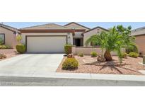 Charming single-story home with a two-car garage and meticulously landscaped front yard at 2555 Moonlight Valley Ave, Henderson, NV 89044