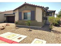 Charming single-story home with a desert-landscaped front yard, featuring gravel and young trees at 2822 Chetco River St, Laughlin, NV 89029